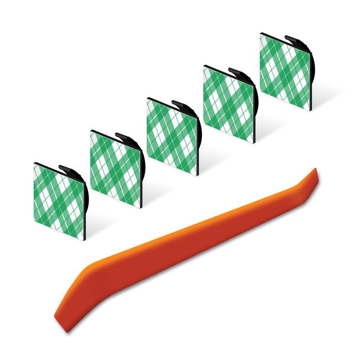 Five cable hiding clips with green plaid covers and orange wire trim tool