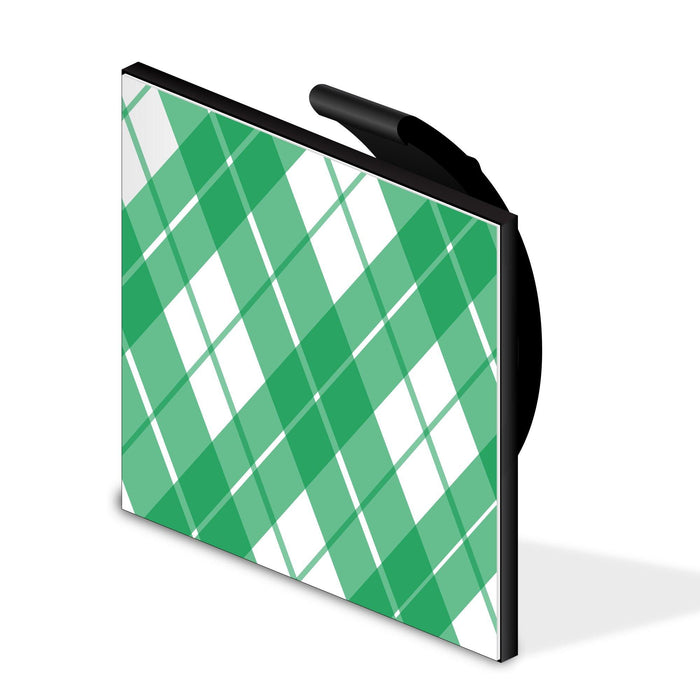 Cable hiding clip with black handle and green plaid cover panel