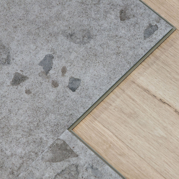 Close up of Galaway Grey terrazzo LVT floor click lock and microbevel edge