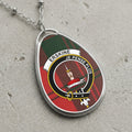 Erskine clan Scottish tartan necklace with clan crest and Je Pense Plus motto on tartan background