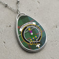 Ferguson clan Scottish tartan necklace with clan crest and Dulcius Ex Asperis motto on tartan background