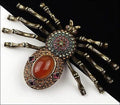 Heidi Daus Figural Faux Carnelian Glass Rhinestone Spider Brooch Pin Web Weaver
