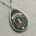 Henderson clan Scottish tartan necklace with clan crest and Sola Virtus Nobilitat motto on tartan background