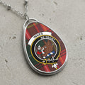 Innes clan Scottish tartan necklace with clan crest and Be Traist motto on tartan background