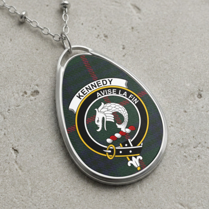 Kennedy clan Scottish tartan necklace with clan crest and Avise La Fin motto on tartan background