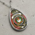 Kinnaird clan Scottish tartan necklace with clan crest on tartan background
