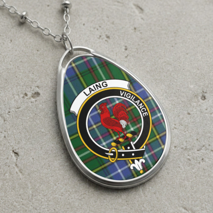 Laing clan Scottish tartan necklace with clan crest on tartan background