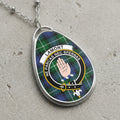 Lamont clan Scottish tartan necklace with clan crest and Ne Parcas Nec Spernas motto on tartan background