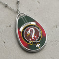 Lennox clan Scottish tartan necklace with clan crest on tartan background