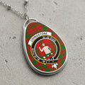 Livingstone clan Scottish tartan necklace with clan crest and Si Je Puis motto on tartan background