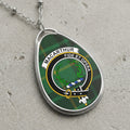 MacArthur clan Scottish tartan necklace with clan crest and Fide Et Opera motto on tartan background