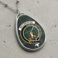 MacBrayne clan Scottish tartan necklace with clan crest on tartan background