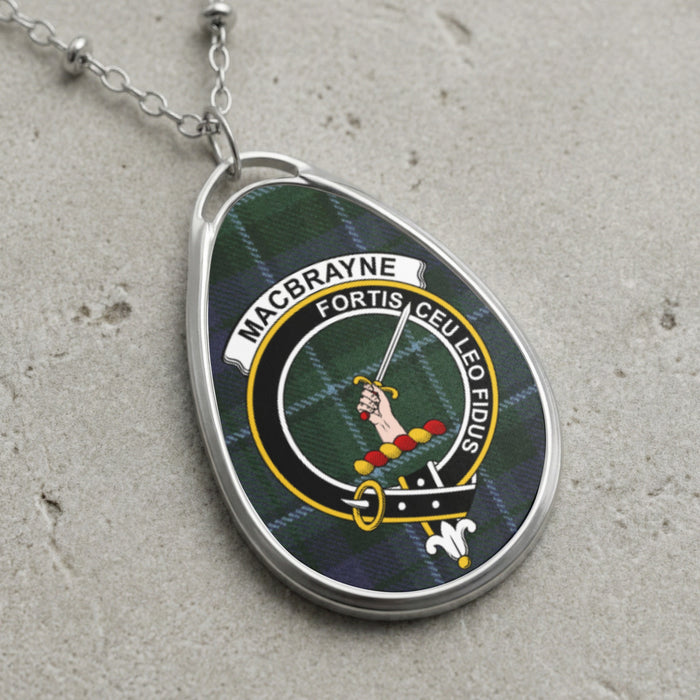 MacBrayne clan Scottish tartan necklace with clan crest on tartan background
