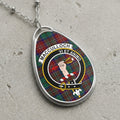 MacCulloch clan Scottish tartan necklace with clan crest and Vi Et Animo motto on tartan background