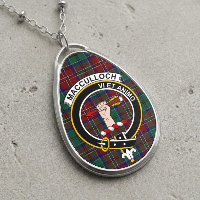 MacCulloch clan Scottish tartan necklace with clan crest and Vi Et Animo motto on tartan background