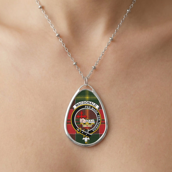 Close-up of the glossy MacDonald crest pendant on its silver-tone necklace