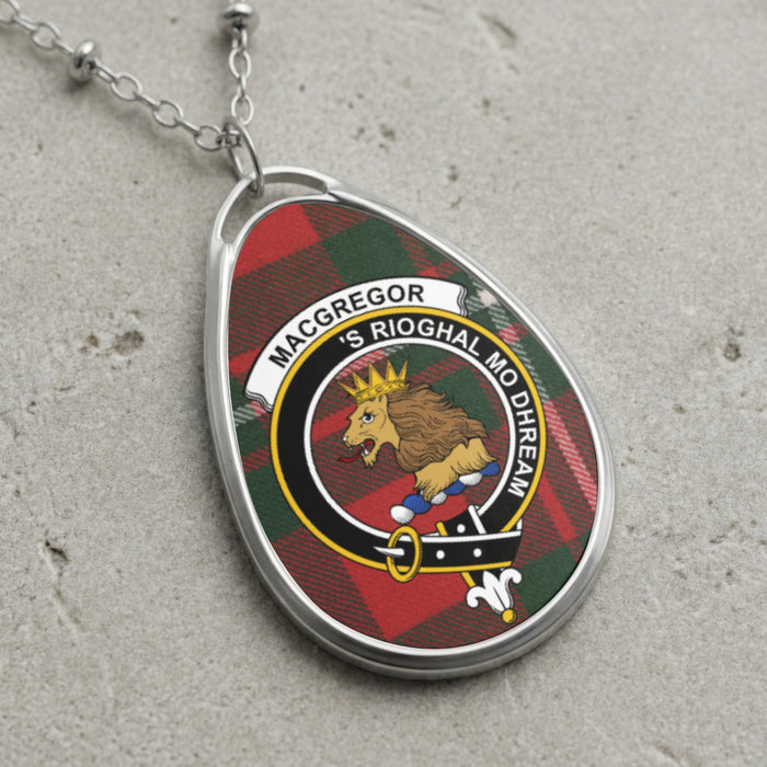 MacGregor clan Scottish tartan necklace with clan crest and 'S Rioghal Mo Dhream motto on tartan background