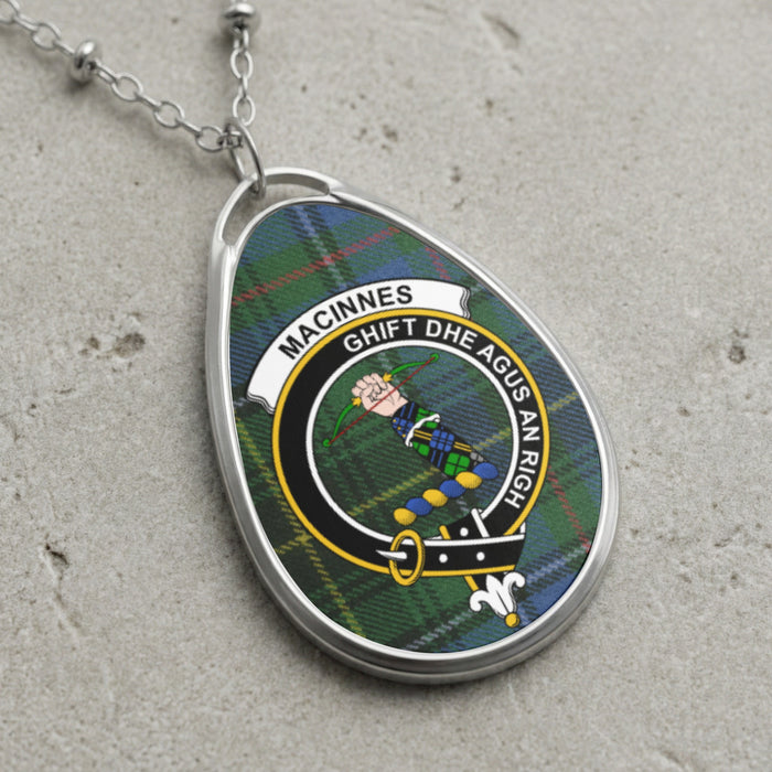 MacInnes clan Scottish tartan necklace with clan crest and By God and the King motto on tartan background