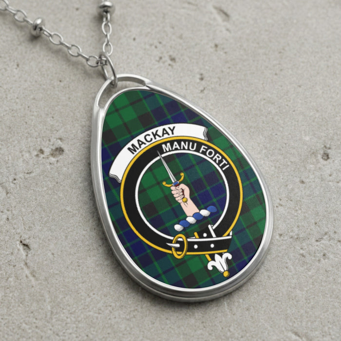 Mackay clan Scottish tartan necklace with clan crest and Manu Forti motto on tartan background