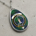 Mackay clan Scottish tartan necklace with clan crest and Manu Forti motto on tartan background
