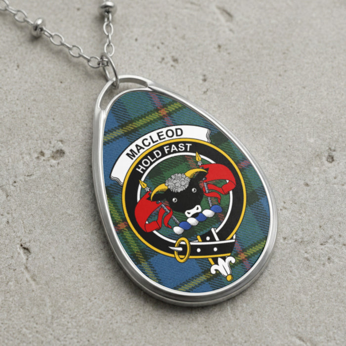 MacLeod clan Scottish tartan necklace with clan crest and Hold Fast motto on tartan background