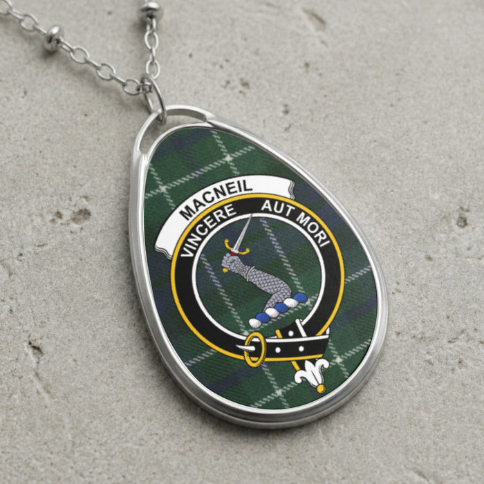 Macneil clan Scottish tartan necklace with clan crest and Vincere Aut Mori motto on tartan background