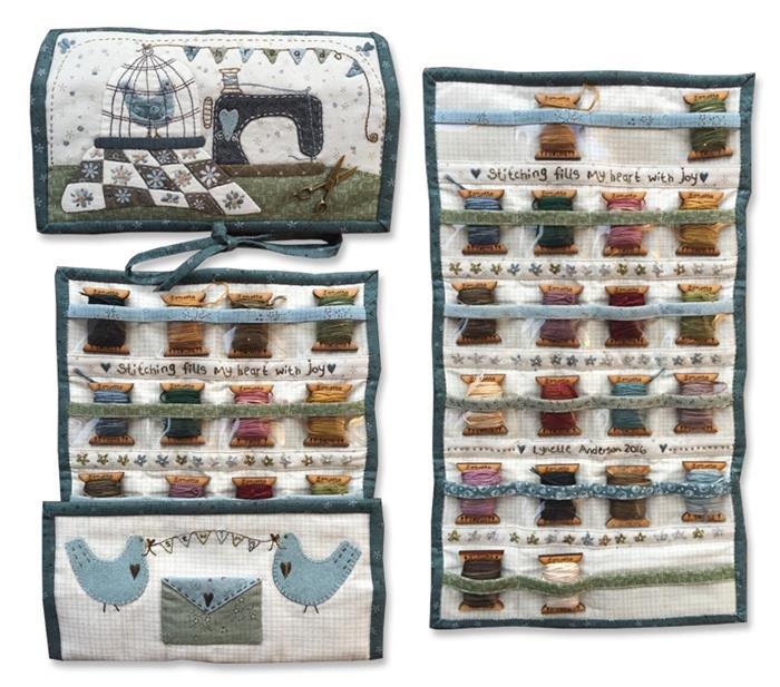 A floss organizer with various compartments, including pockets for needles and a tapestry project with applique designs featuring birds and flowers.
