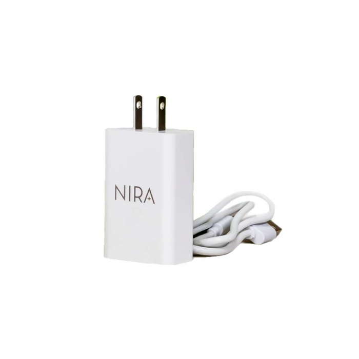 White NIRA Power Adapter & Charging Cable with two-prong plug and USB cable neatly coiled beside it