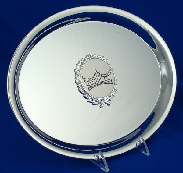 A nickel plated, oval-shaped tray with the Schoppy's Crown Logo engraved in the center with Blue Background