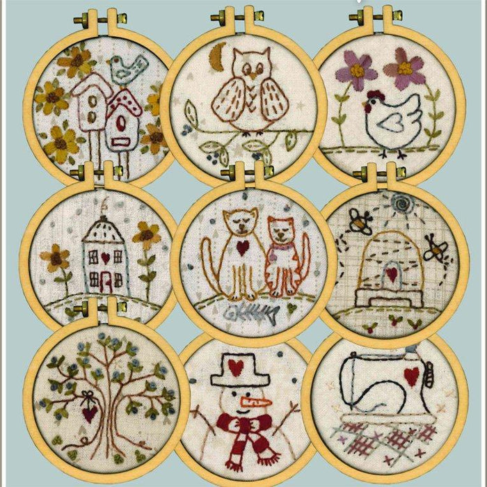 A set of 10 different stitching patterns for mini hoops, featuring various designs including a house, an owl, a cat, a bird, and a Christmas tree.